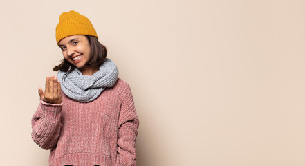 young woman looking goofy and funny with a silly cross-eyed expression, joking and fooling around