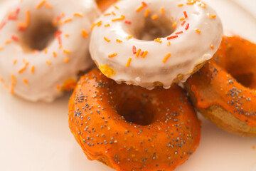 Sugar-glazed donuts (white and orange) - baked