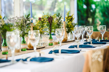 Table decoration for a special occasion -  boho wedding table set up. Outdoor wedding/party
