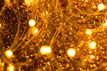 Abstract light-Emitting diodes on a wire, Christmas lights located on a dark background with sequins