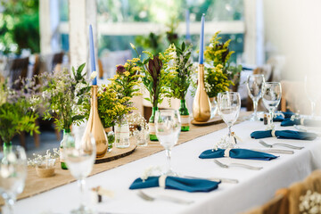 Table decoration for a special occasion -  boho wedding table set up. Outdoor wedding/party