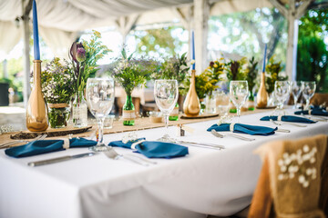 Table decoration for a special occasion -  boho wedding table set up. Outdoor wedding/party