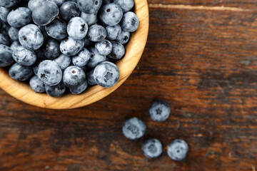 Fresh blueberries in a wooden bowl