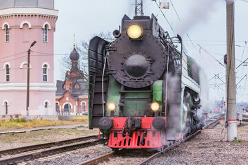 Plakat Retro steam locomotive departs from the station. Alexandrov. Russia.
