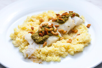 cod with green pesto and pine seeds with couscous