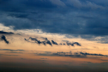 Fototapeta na wymiar clouds on horizon with different shapes. nice backgrounds with copy space.