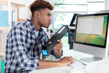 technician researching a toner cartridge on his computer