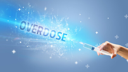 Syringe, medical injection in hand with OVERDOSE inscription, medical antidote concept