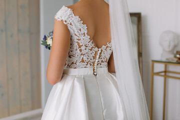 Fototapeta na wymiar Bride in white wedding dress for ceremony