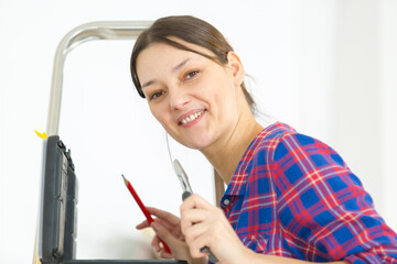 woman posing on a ladder