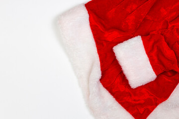 Obraz na płótnie Canvas Part of Santa Claus clothing isolated on white. Red fur. Flat lay.