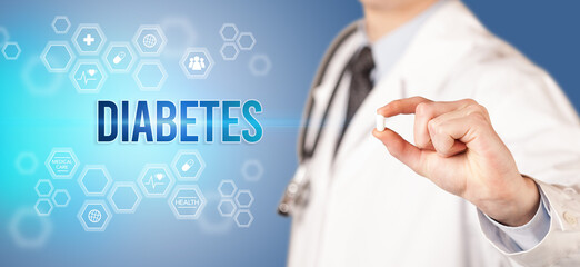 Close-up of a doctor giving you a pill with DIABETES inscription, medical concept