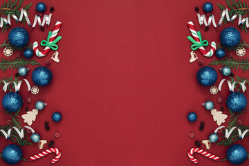 New Year's, festive decor on a red background. Copy space, flat lay, mock up, top view