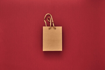 Gift boxes and gift bag on a red background. Black Friday. Copy space, flat lay, mock up, top view