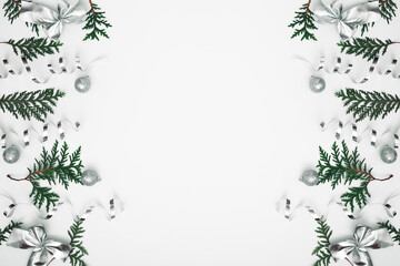 Obraz premium Thuja branches, spruce and New Year's decor. Copy space, flat lay, mock up, top view.