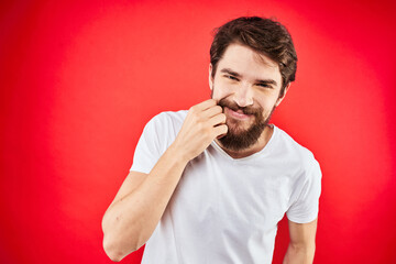 Bearded man fun emotions lifestyle cropped view white t-shirt red background