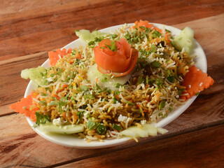 Vegetable / veg biryani with mixed veggies served, selective focus