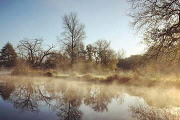 A still River Wey on a cold sunny morning in Godalming, Surrey, UK