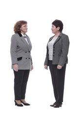 in full growth. two mature women striding forward