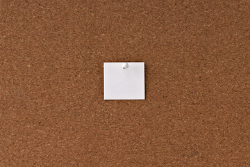 White note paper on a cork wall. Bulletin board. Copy space, flat lay.