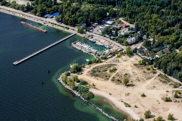 Fototapeta na wymiar Aerial shot of yacht club and green water of the river Volga in Ulyanovsk, Russia.