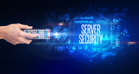 hand holding wireless peripheral with SERVER SECURITY inscription, cyber security concept