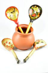 composition, small brown clay pot for sauces, soups, kitchen item, wooden spoons for food