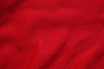 Red sports clothing fabric football shirt jersey texture close up