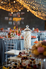 Close up of buffet table with sweet desserts on wedding