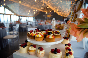 Beautiful wedding candy bar with delicious cupcakes