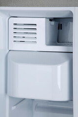 Closeup view of the home refrigerator 
ice maker