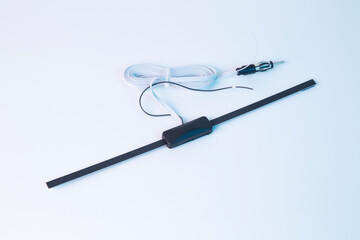 Car antenna inside the showroom on a white background.