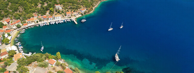 Aerial drone ultra wide photo of picturesque beautiful seaside village of Kioni a safe anchorage for yachts and sailboats, a true gem of Ithaki or Ithaca island, Ionian, Greece