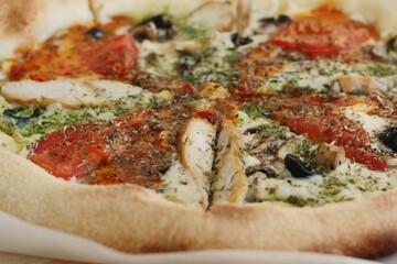 Italian pizza with chicken tomatoes and cheese