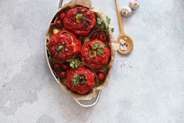 Oven backed red paprika stuffed with meat and vegetables. Overhead view, selective focus