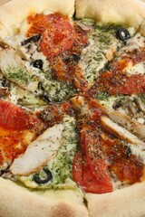 Italian pizza with chicken tomatoes and cheese