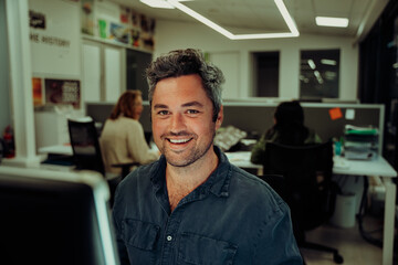 Caucasian business man working on important assignment report in office block, working late hours 