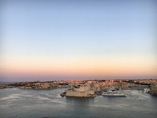Sunset over the sea in Valleta, Malta. 