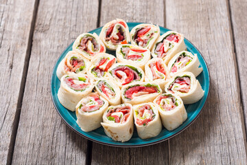 Sliced sandwich tortilla with vegetables and ham