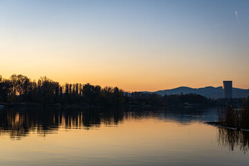 Fototapeta na wymiar Sunset at the old Danube river on a November day in Vienna, Austria