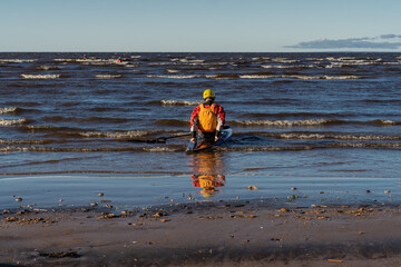back view of man kayaking in the sea. Extreme sports conceps