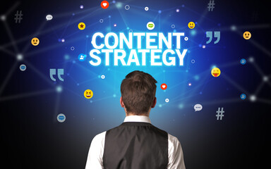 Rear view of a businessman with CONTENT STRATEGY inscription, social networking concept