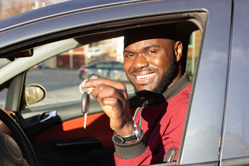 Happy African American with car key © Alexander