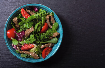 Healthy salad with beef cherry tomatoes