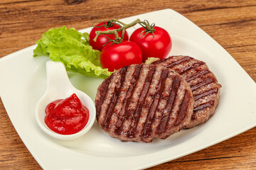 Grilled burger cutlet with sauce