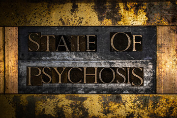 State of Psychosis text message on textured grunge copper and vintage gold background