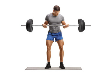 Fototapeta na wymiar Full length portrait of a fit young man lifting heavy weights