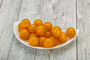 Fresh yellow cherry tomato heap