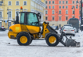 Snow removal in the city with special equipment and people.