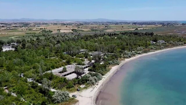 Aerial view of idyllic beach in the area of Thessaloniki, Greece, downward movement by drone